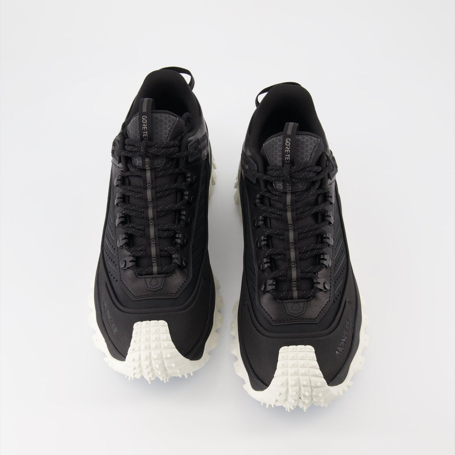 Moncler sneakers, luxury men's footwear, black Trailgrip, high-end sneakers, men's luxury fashion