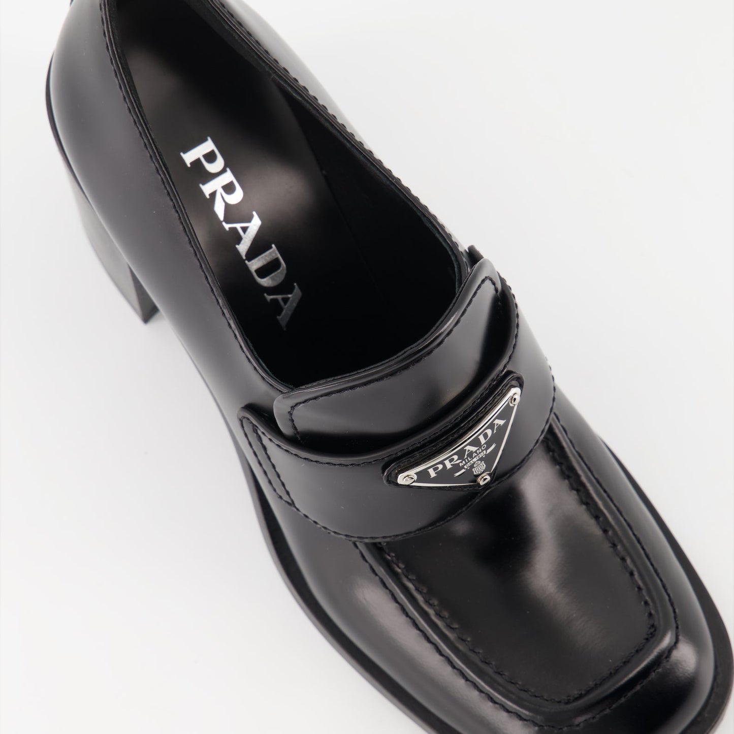 Prada leather moccasins, high-heeled moccasins, women's luxury shoes, polished leather footwear, designer moccasins