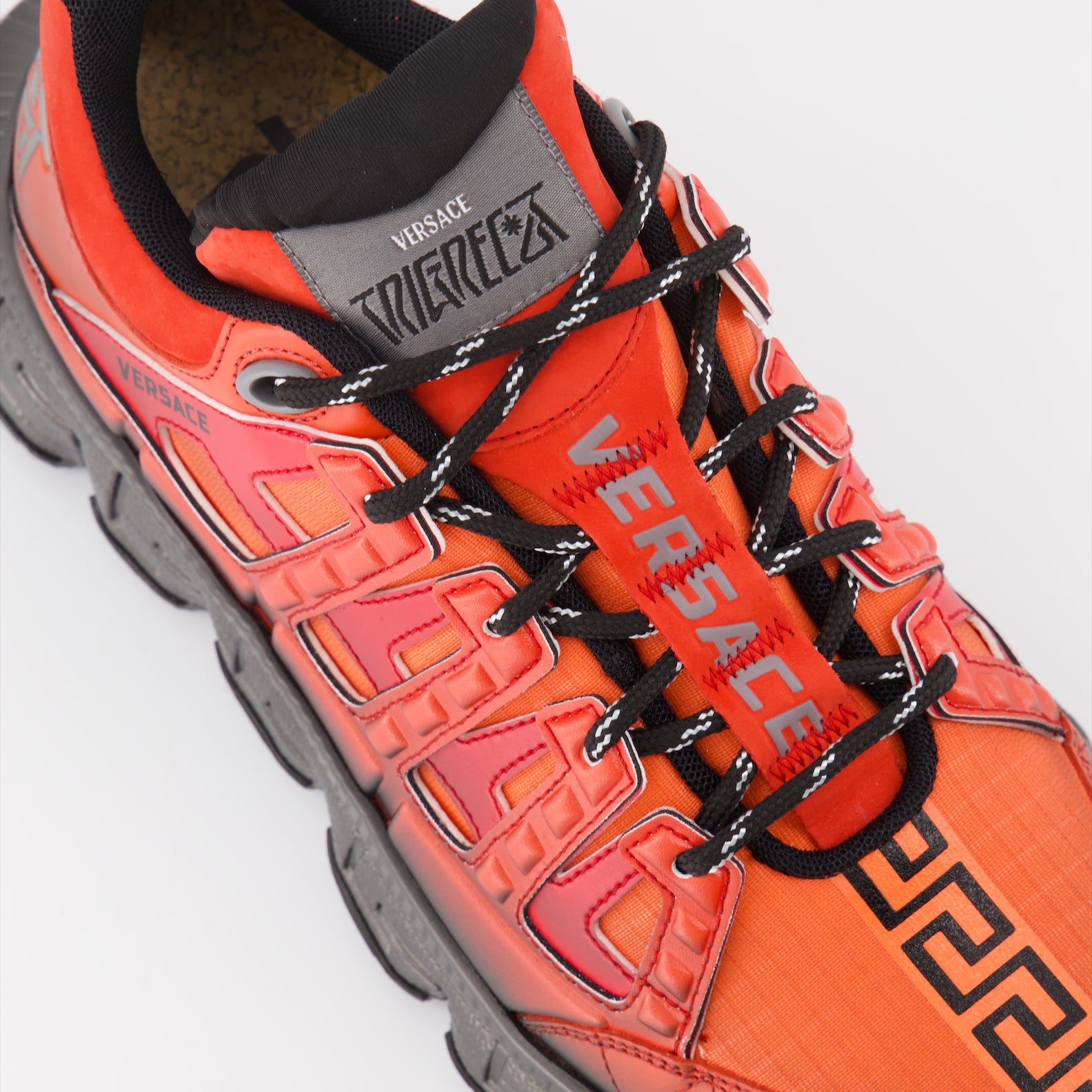 Versace sneakers, men's luxury footwear, Trigreca sneakers, red-black sneakers, high-end fashion shoes