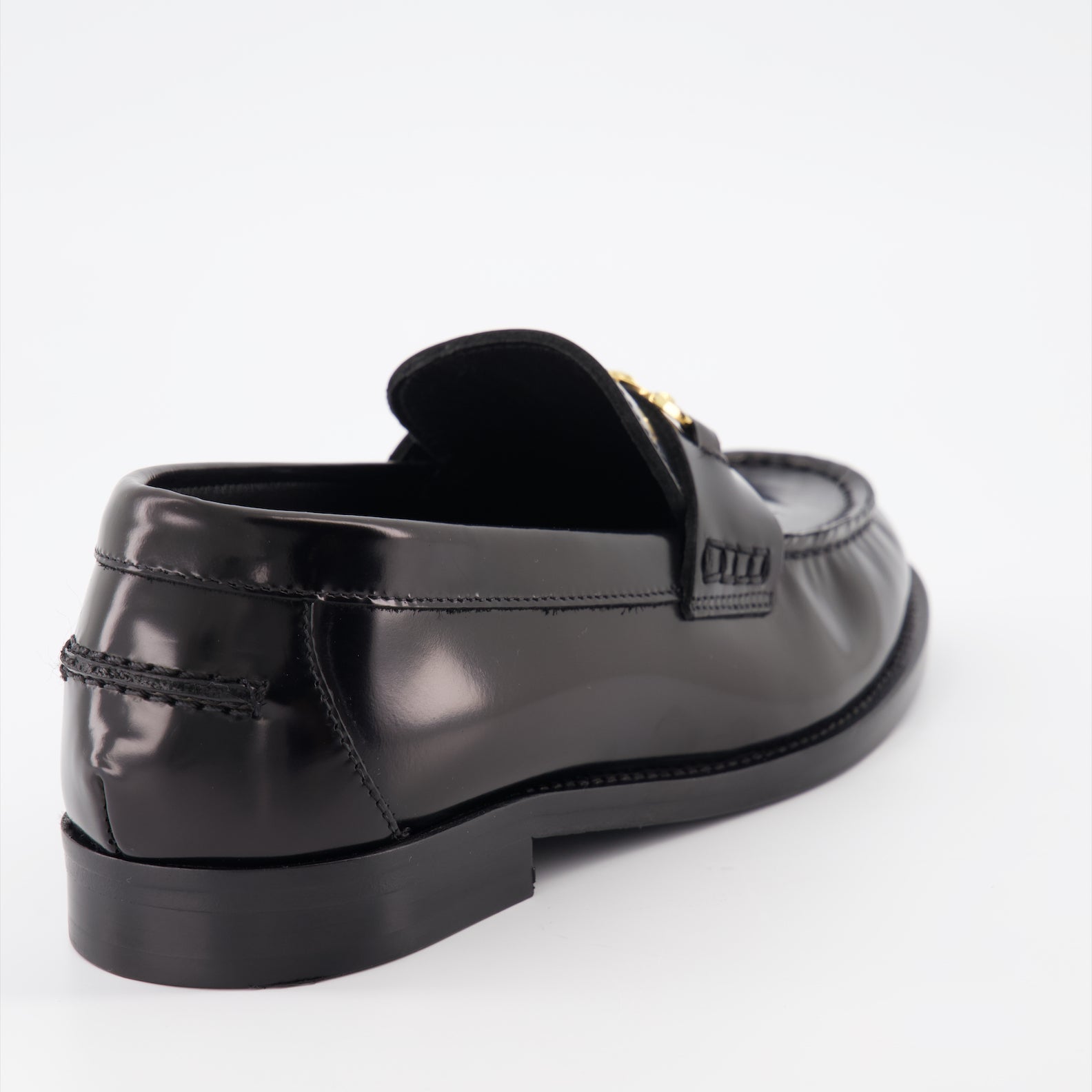 Versace moccasins, luxury women's footwear, Medusa emblem shoes, black leather moccasins, high-end women's shoes