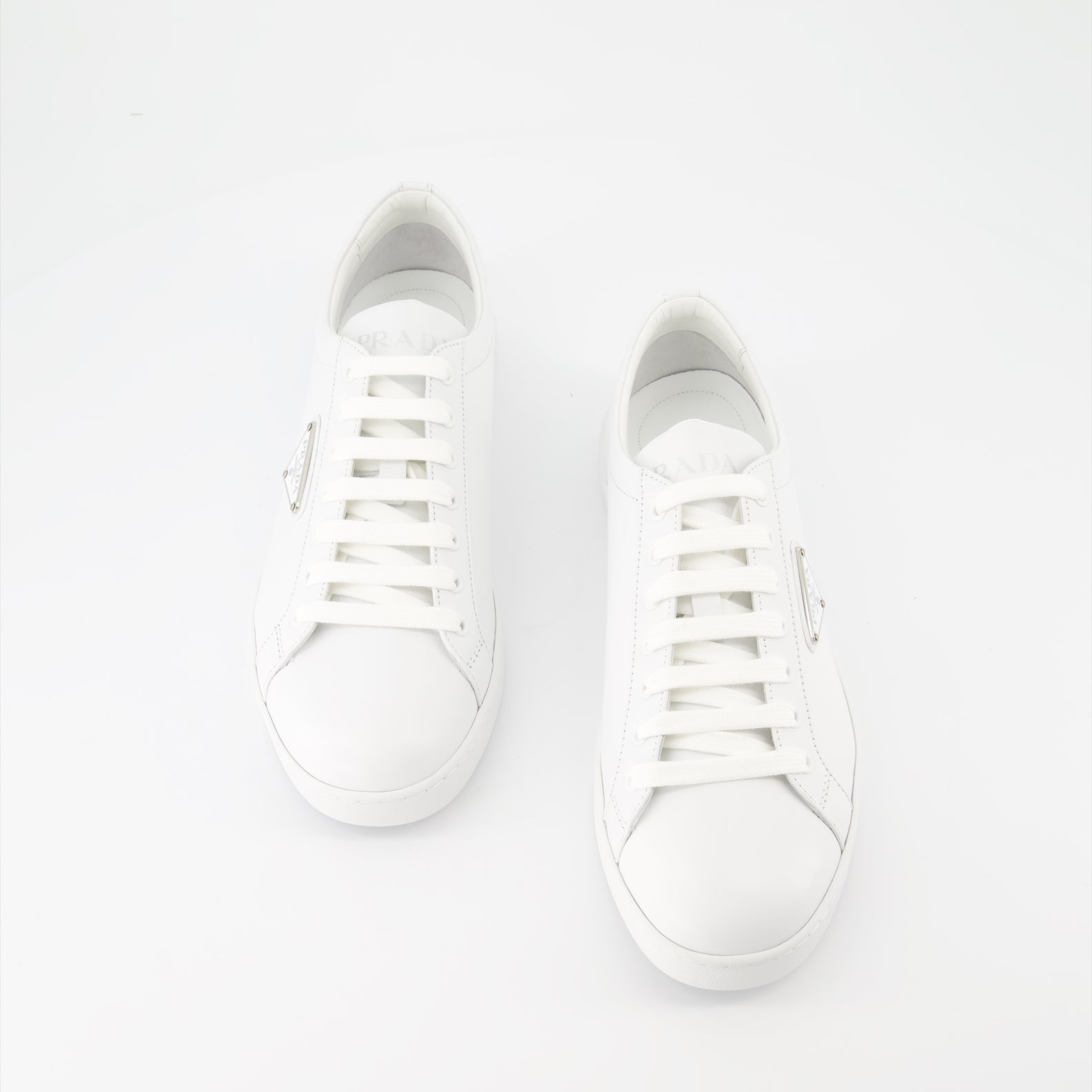   Prada sneakers, white leather sneakers, luxury men's footwear, elegant casual shoes, high-end sneakers  