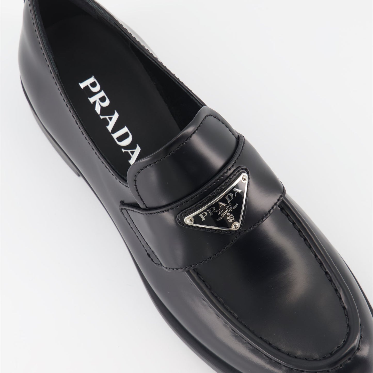 luxury moccasins, brushed leather loafers, elegant footwear, Prada shoes, refined fashion