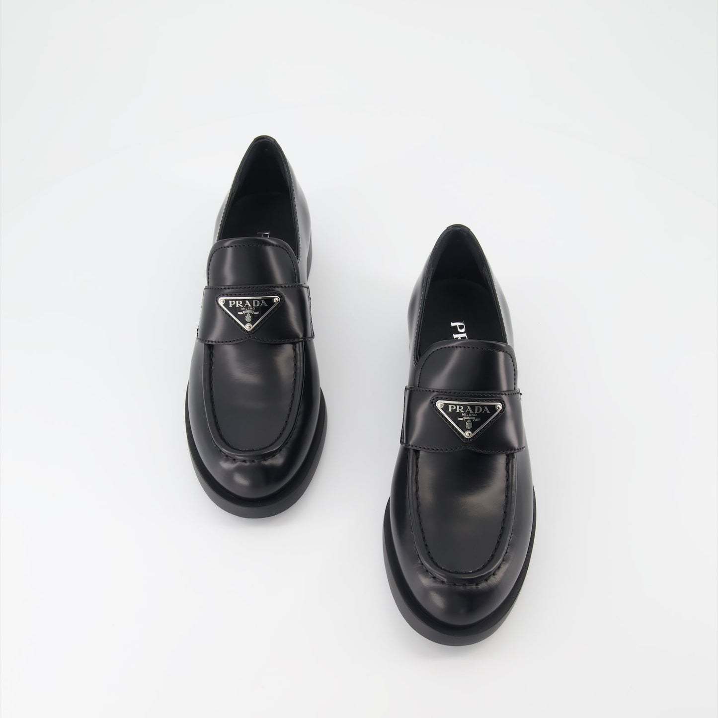 luxury moccasins, brushed leather loafers, elegant footwear, Prada shoes, refined fashion