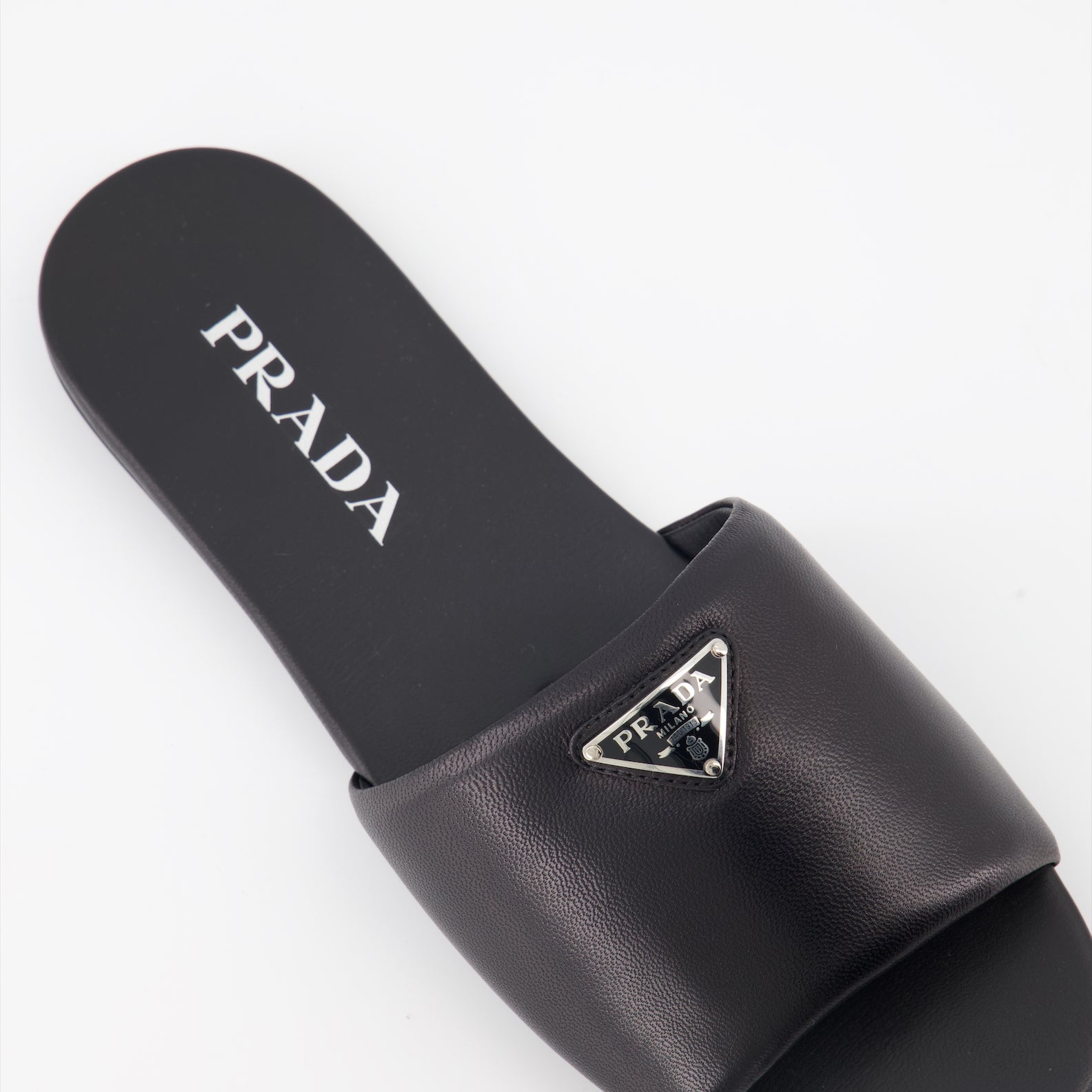 Prada, black leather slides, luxury footwear, nappa leather, designer slides