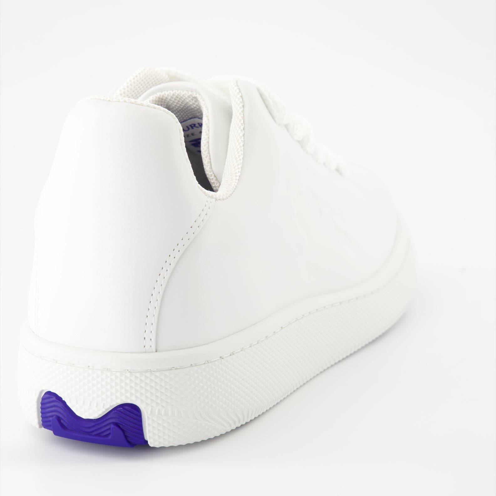 White leather sneakers, Burberry EKD, luxury footwear, stylish sneakers, elegant leather sneakers