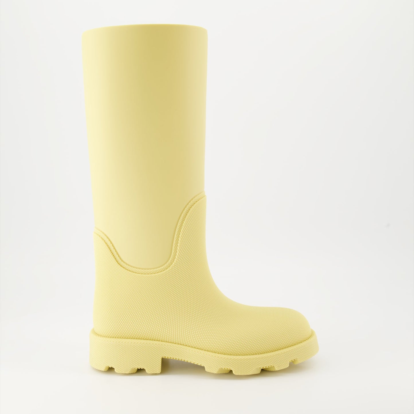 1. Luxury rain boots2. Yellow rubber boots3. Burberry footwear4. Fashionable rain gear5. Designer rain boots