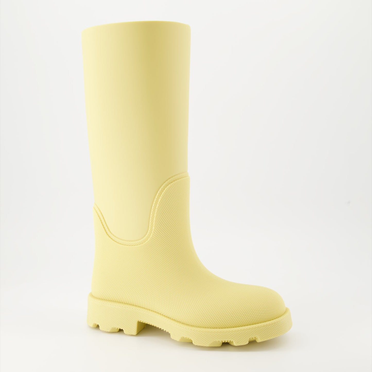 1. Luxury rain boots2. Yellow rubber boots3. Burberry footwear4. Fashionable rain gear5. Designer rain boots