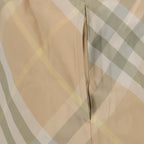 Burberry swim shorts, beige checkered swim shorts, luxurious swimwear, designer swim shorts, high-end beachwear