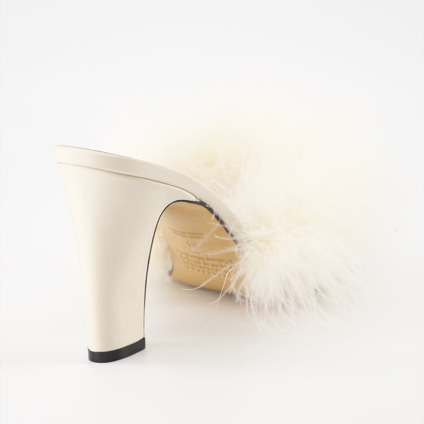 Maison Margiela, feather-trimmed mules, luxury footwear, designer shoes, elegant mules