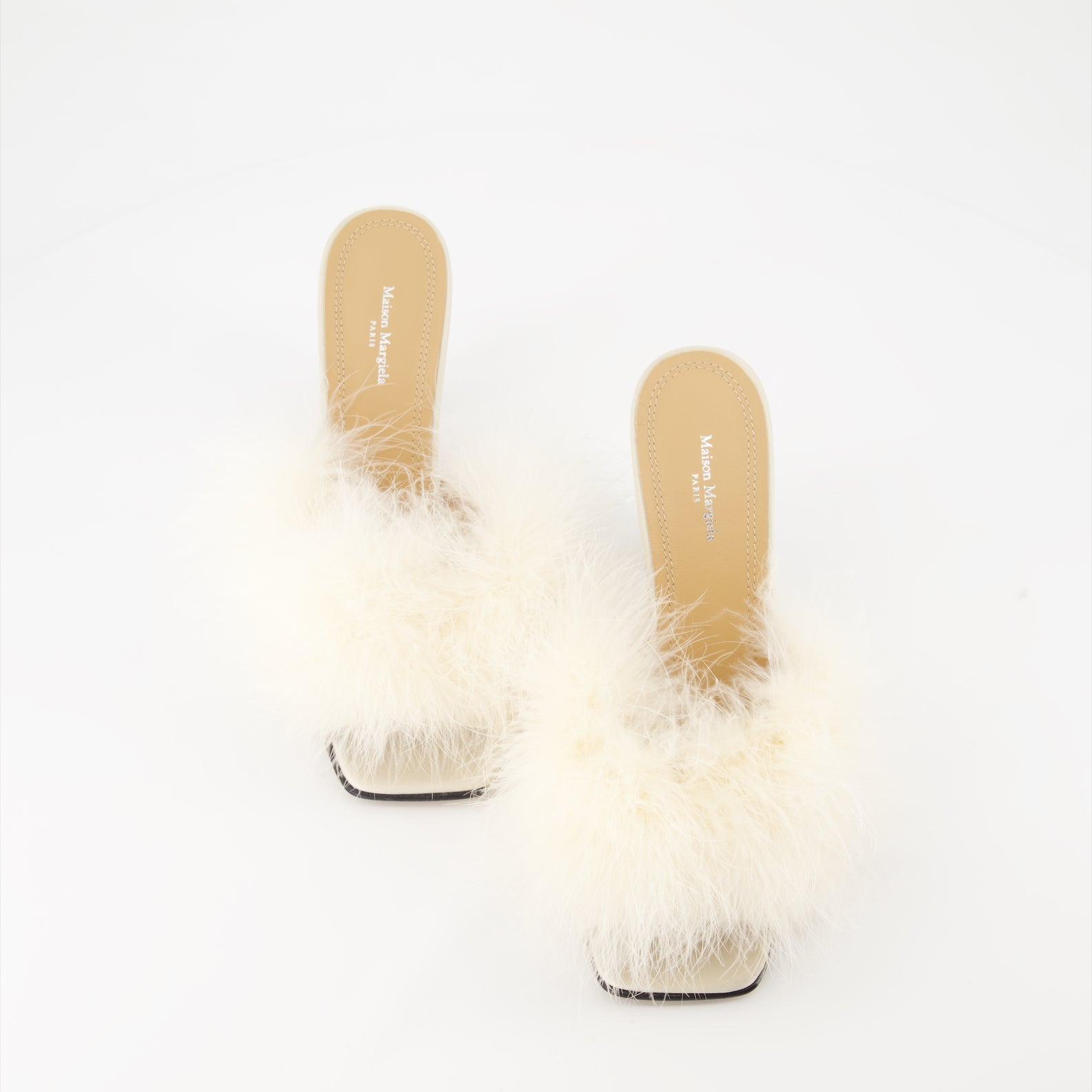 Maison Margiela, feather-trimmed mules, luxury footwear, designer shoes, elegant mules