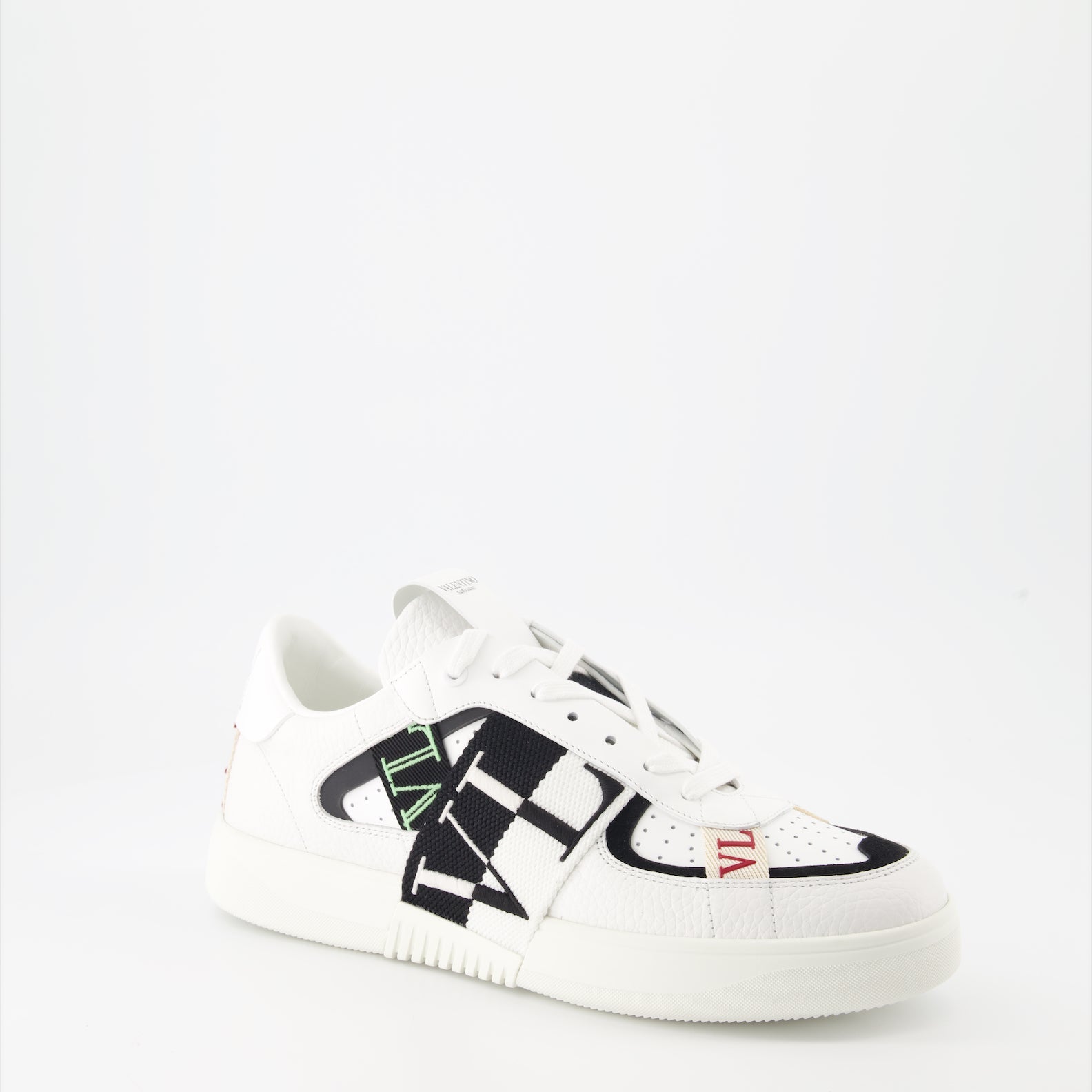 Valentino Garavani sneakers, luxury leather sneakers, white sneakers with black details, designer footwear, high-end fashion sneakers