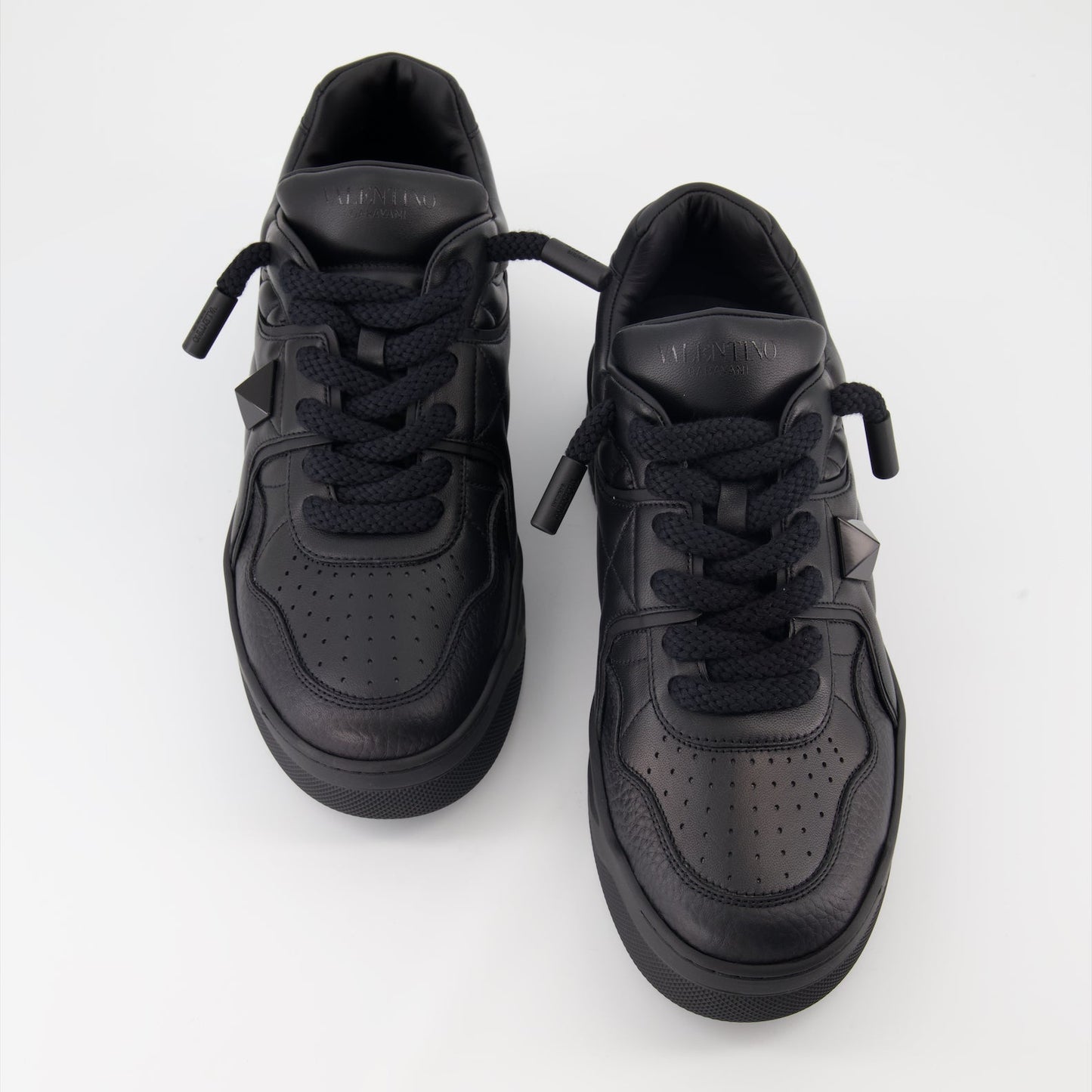 Valentino Garavani sneakers, black leather sneakers, luxury footwear, designer sneakers, Valentino rockstud