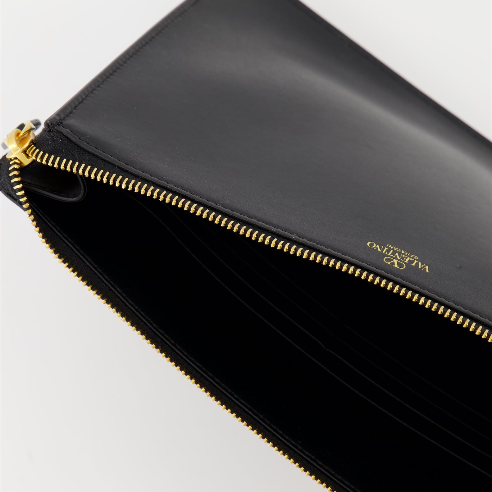 luxury leather clutch, Valentino Garavani, smooth leather accessory, high-end fashion, sophisticated clutch