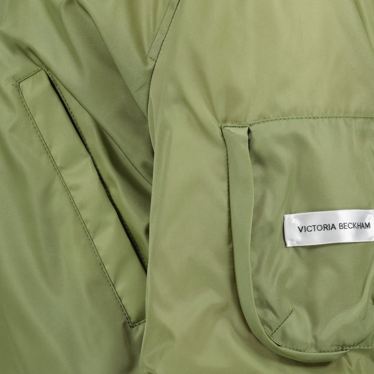 Green bomber jacket, nylon bomber, Victoria Beckham outerwear, luxury bomber jacket, high-end fashion