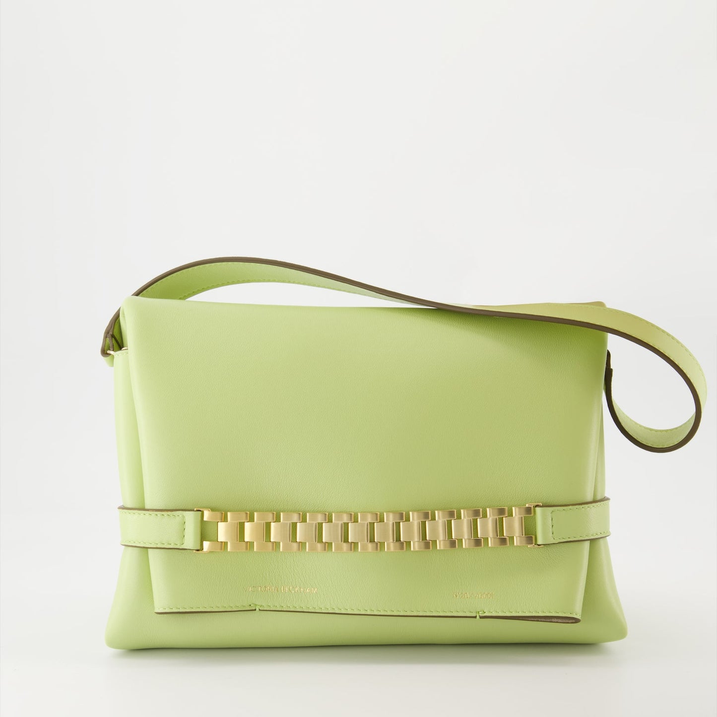 Victoria Beckham, green leather pochette, chain strap bag, luxury accessory, designer handbag