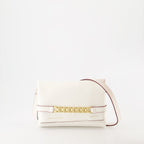 White leather pochette, luxury chain bag, Victoria Beckham accessories, elegant white clutch, high-end fashion