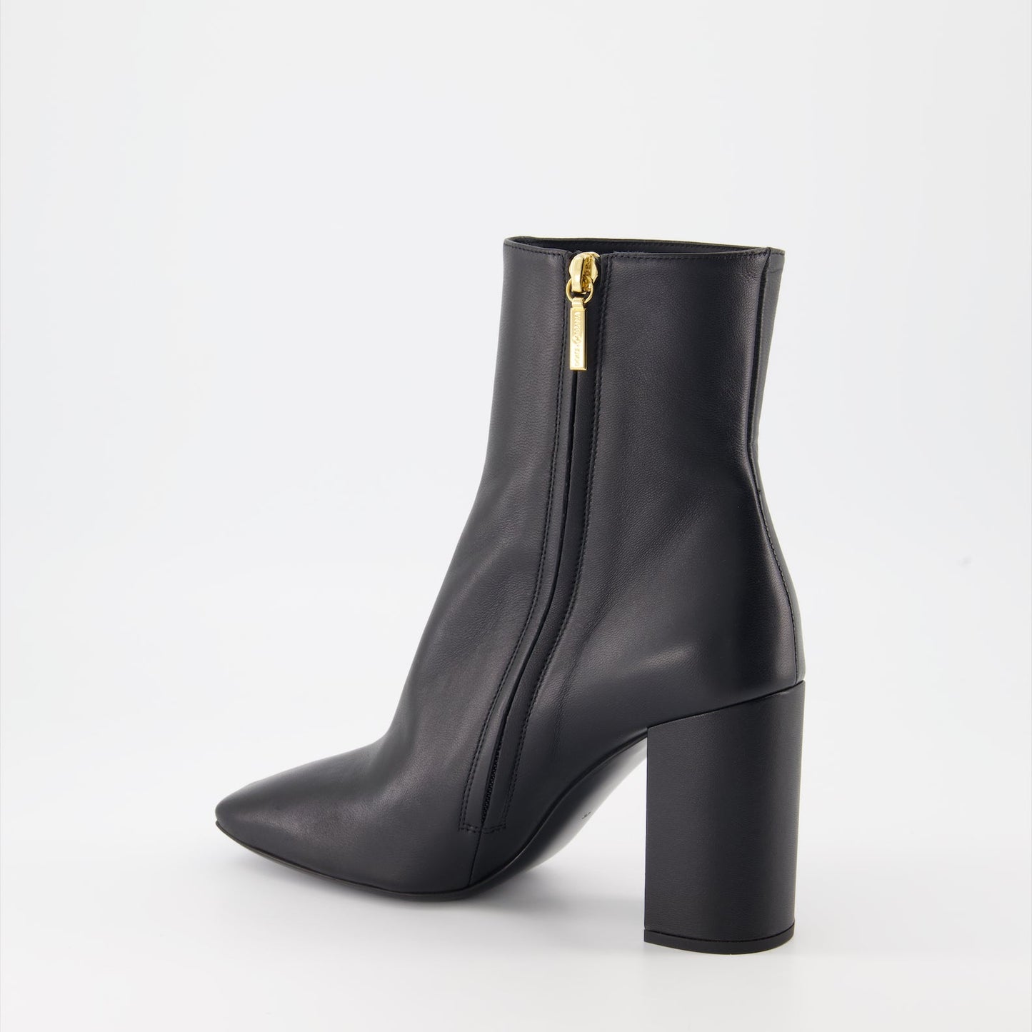 High-heel leather boots, Dolce & Gabbana ankle boots, luxury Italian footwear, designer leather boots, elegant high-heel shoes