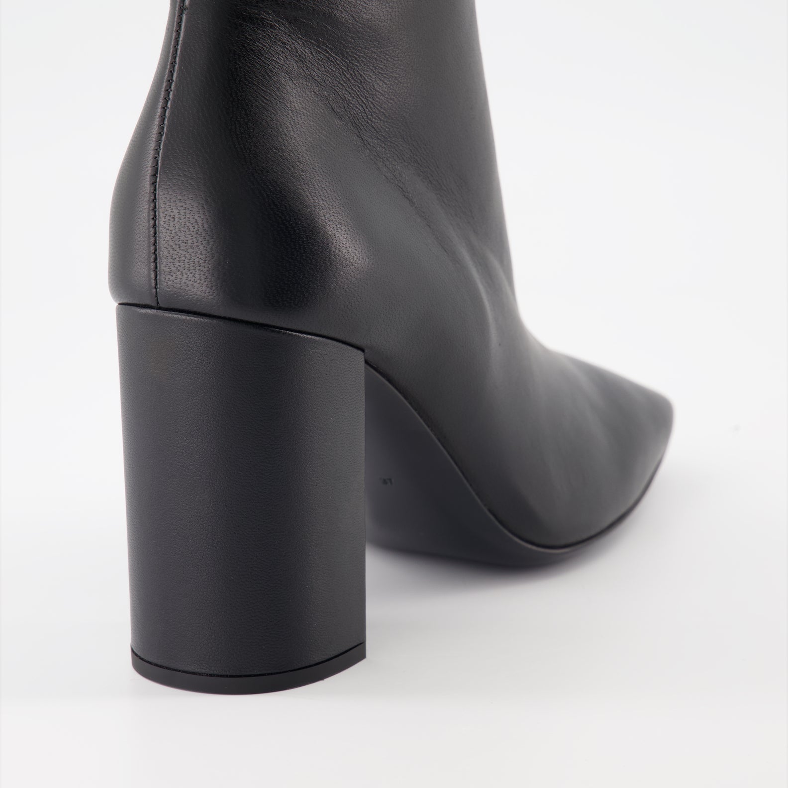 High-heel leather boots, Dolce & Gabbana ankle boots, luxury Italian footwear, designer leather boots, elegant high-heel shoes