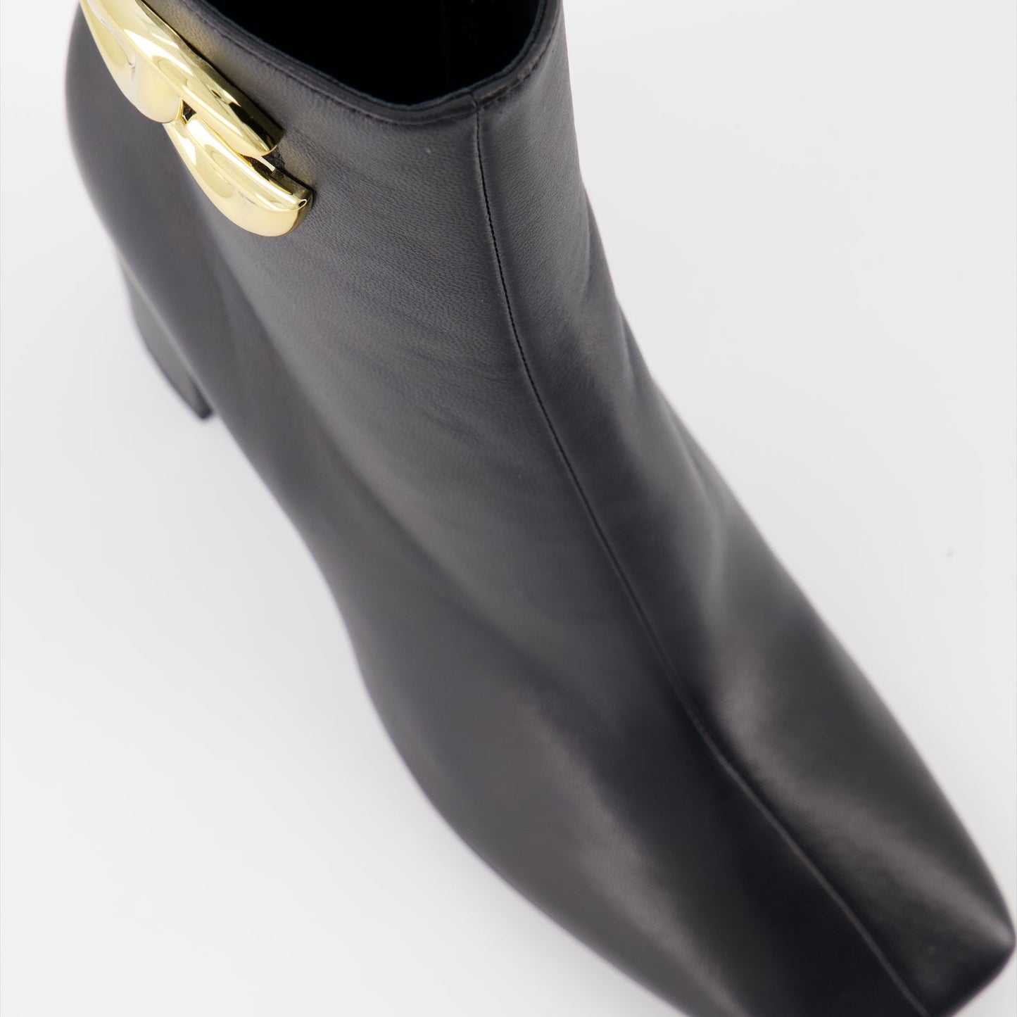 High-heel leather boots, Dolce & Gabbana ankle boots, luxury Italian footwear, designer leather boots, elegant high-heel shoes