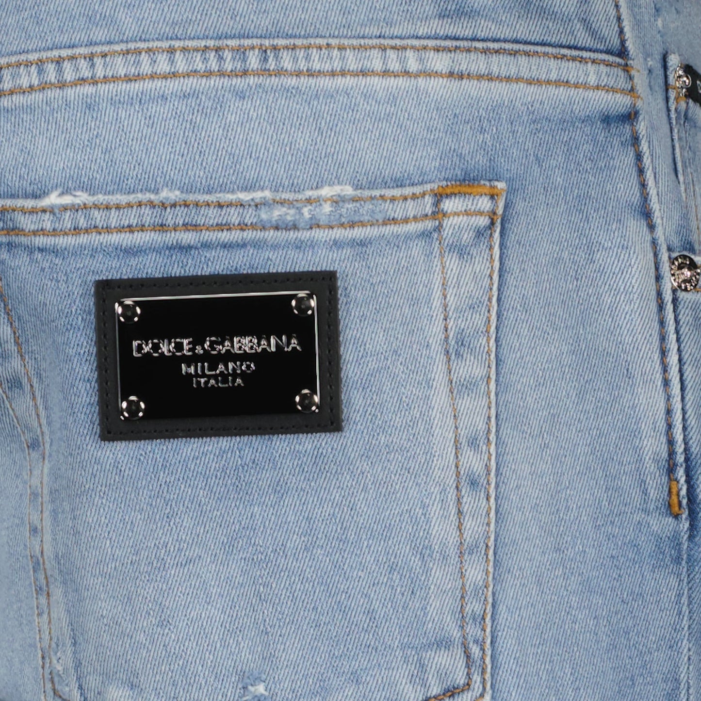 Dolce & Gabbana jeans, light blue distressed jeans, luxury denim, Italian fashion, designer wear