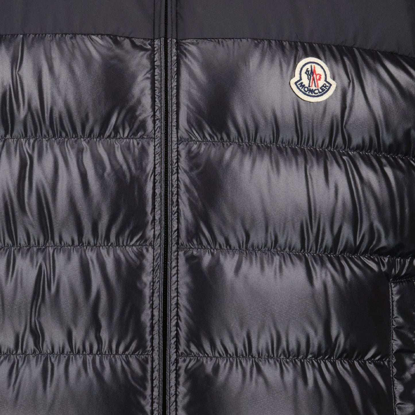 black sleeveless down jacket, luxury menswear, Moncler down jacket, high-end fashion, designer outerwear