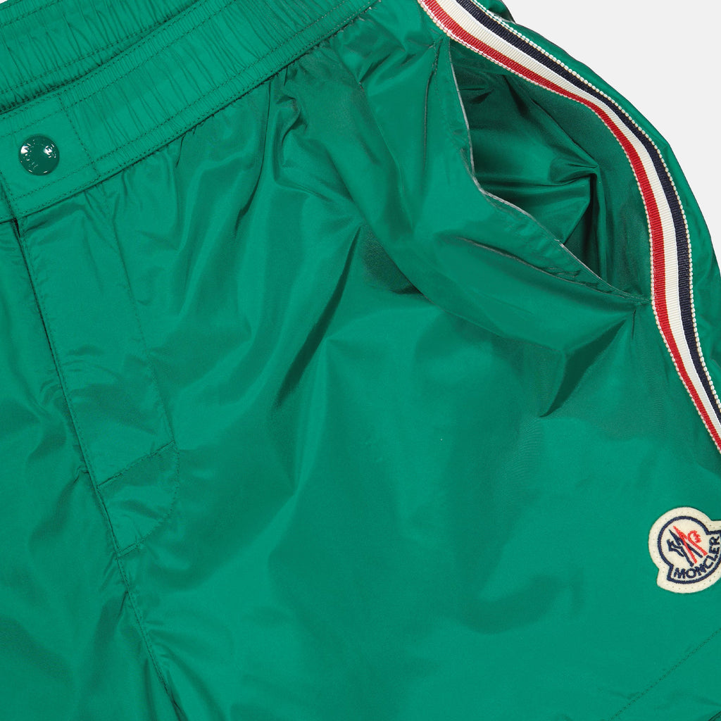 luxury swim shorts, green swimwear, tricolor trim shorts, Moncler beachwear, refined swim shorts