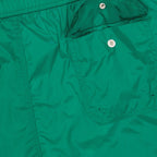 luxury swim shorts, green swimwear, tricolor trim shorts, Moncler beachwear, refined swim shorts