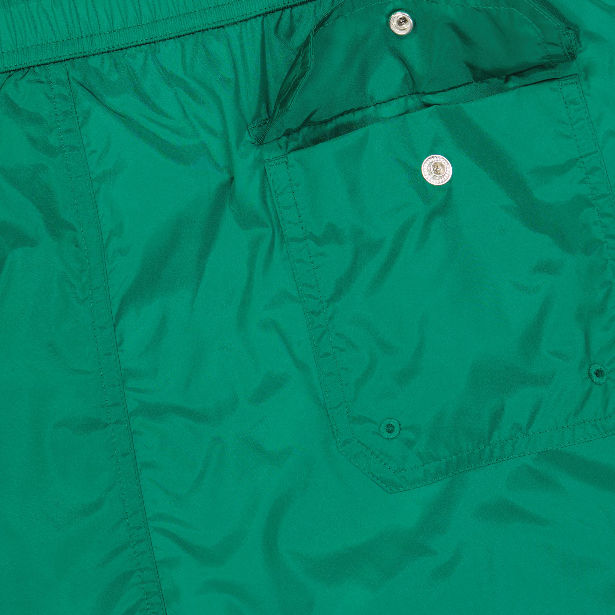 luxury swim shorts, green swimwear, tricolor trim shorts, Moncler beachwear, refined swim shorts