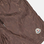 Moncler swim shorts, luxury swimwear, monogrammed shorts, designer beachwear, elegant swimwear