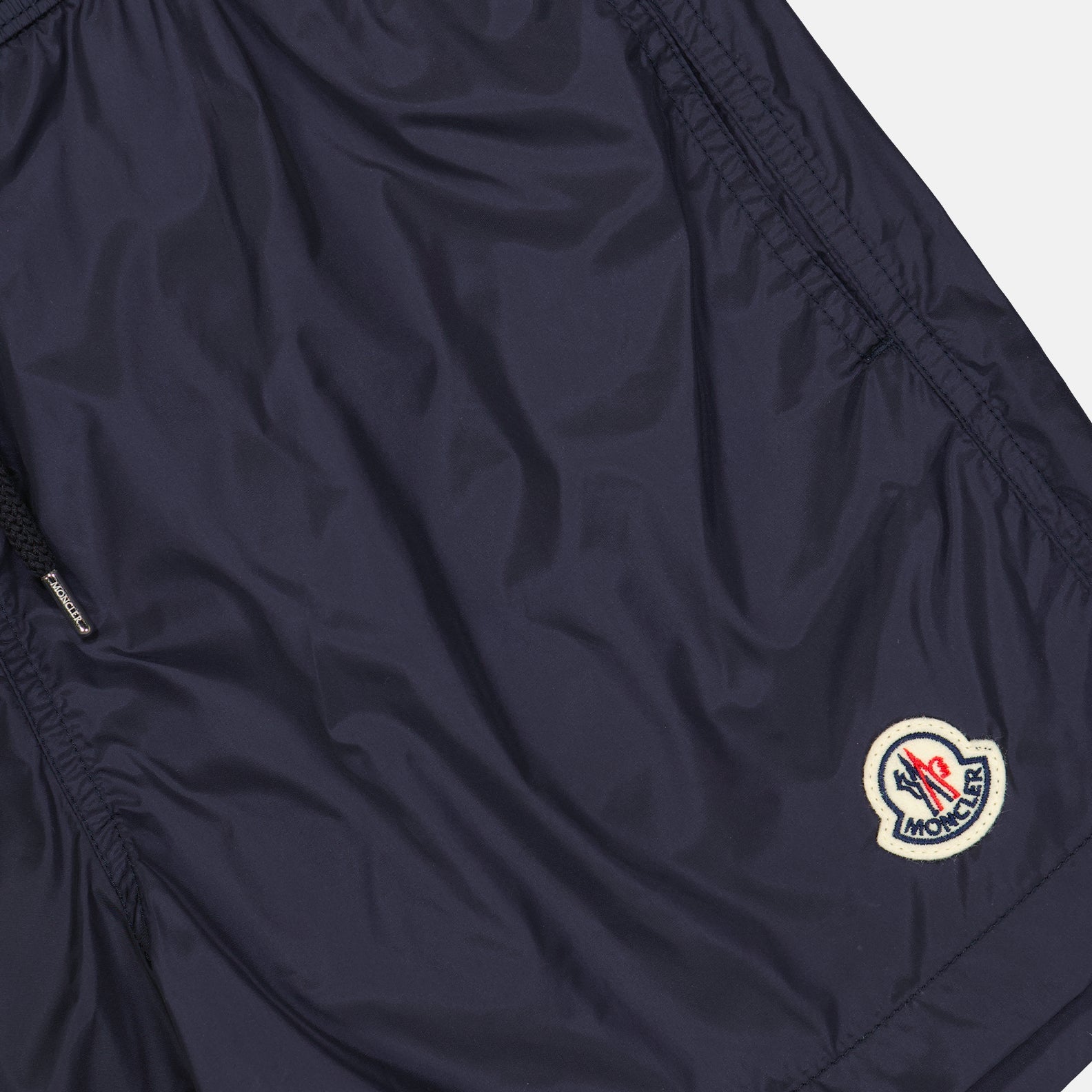 Moncler swim shorts, blue swim shorts, luxury beachwear, high-end swimwear, designer swim shorts