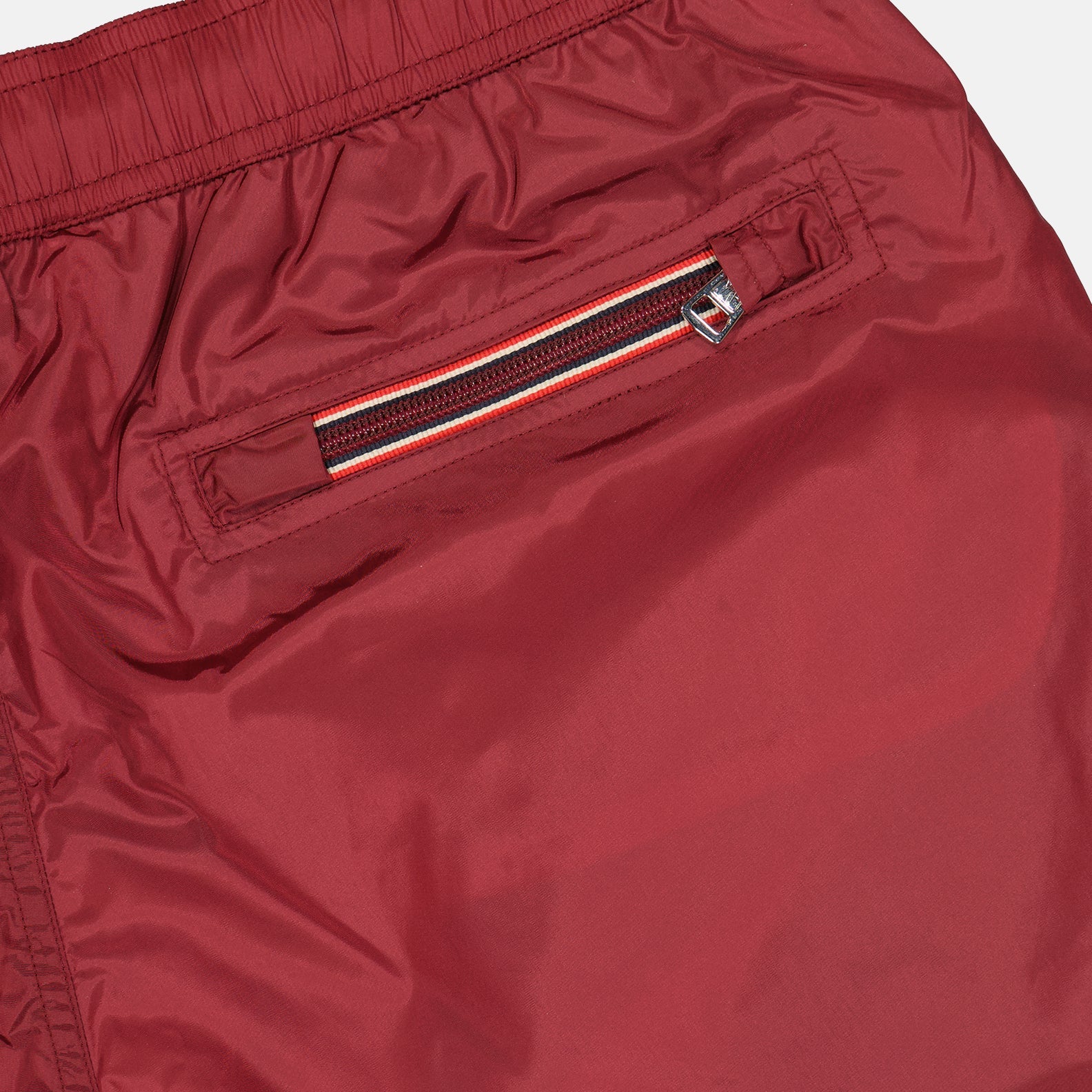 moncler swim shorts, burgundy logo shorts, luxury swimwear, premium swim shorts, high-end beachwear