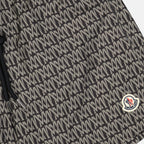 Monogrammed swim shorts, luxury beachwear, Moncler, black and white swim shorts, high-end swimwear