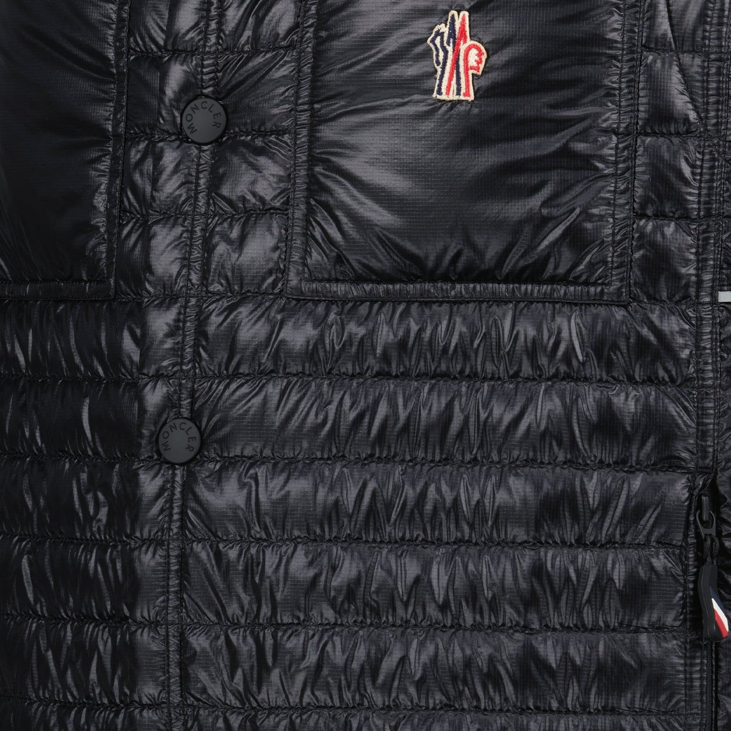 luxury vest, padded nylon vest, Moncler Grenoble vest, black sleeveless jacket, high-end outerwear