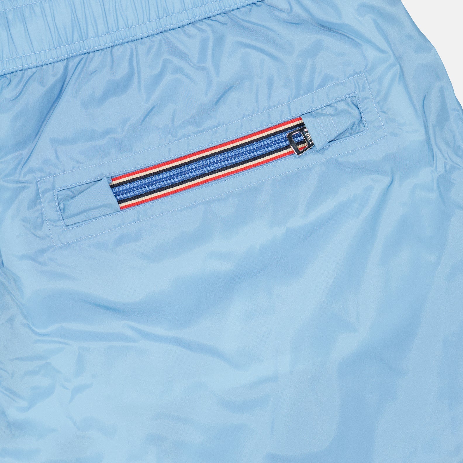 light blue swim shorts, Moncler logo swimwear, luxury beachwear, men's designer shorts, premium swim shorts