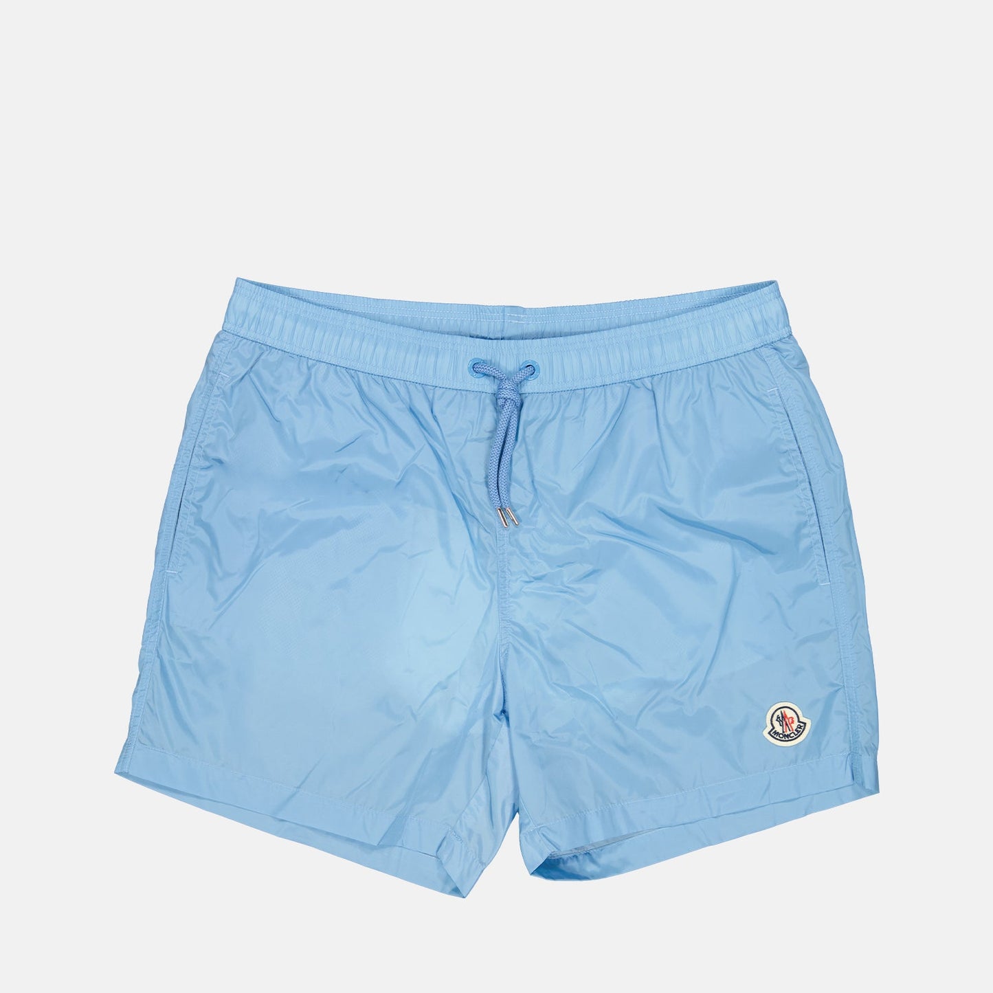 light blue swim shorts, Moncler logo swimwear, luxury beachwear, men's designer shorts, premium swim shorts