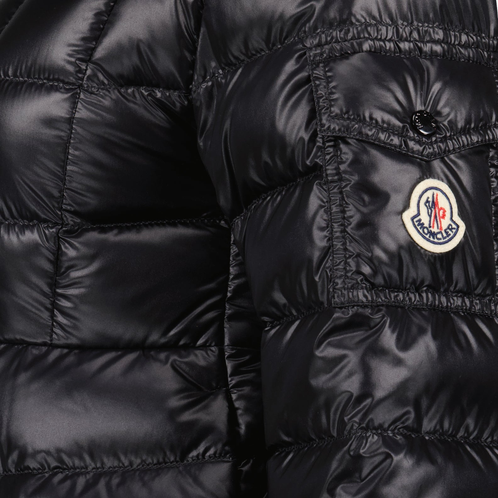 luxury outerwear, black down jacket, Moncler jacket, winter fashion, high-end fashion