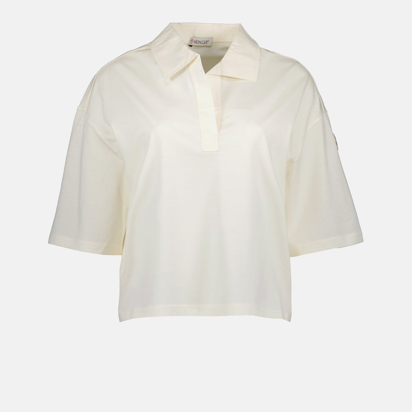 Moncler polo shirt, luxury casual polo, classic white polo, high-end fashion, refined elegance