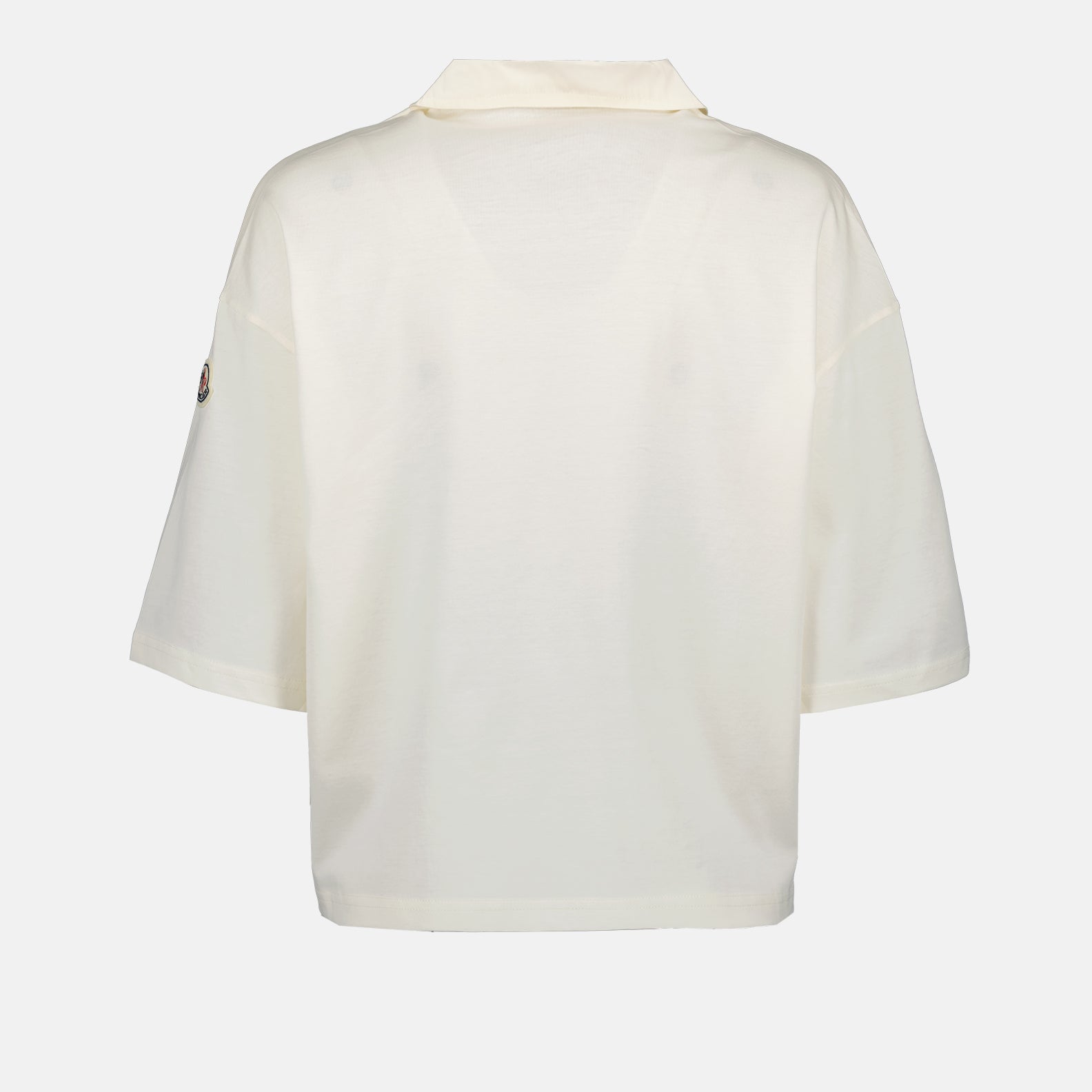 Moncler polo shirt, luxury casual polo, classic white polo, high-end fashion, refined elegance