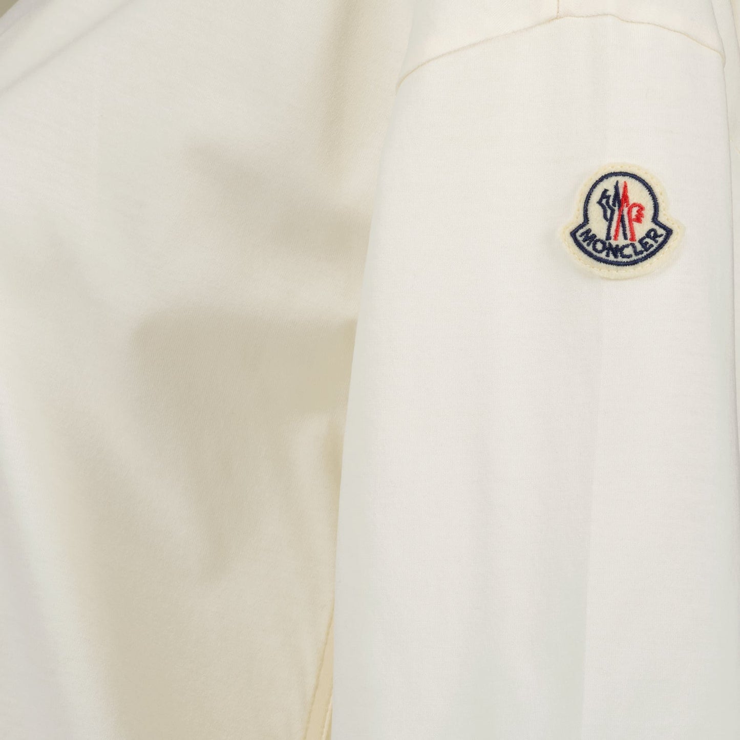 Moncler polo shirt, luxury casual polo, classic white polo, high-end fashion, refined elegance