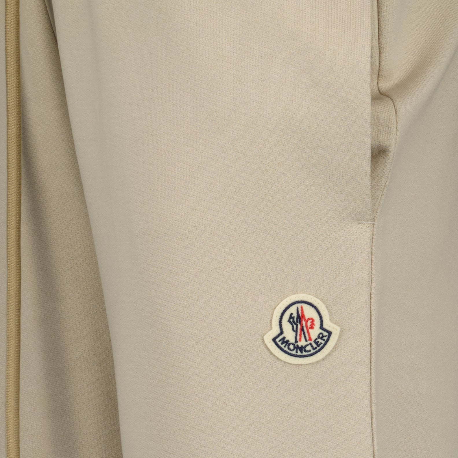 beige jogging pants, Moncler, logo jogging pants, luxury loungewear, cotton joggers