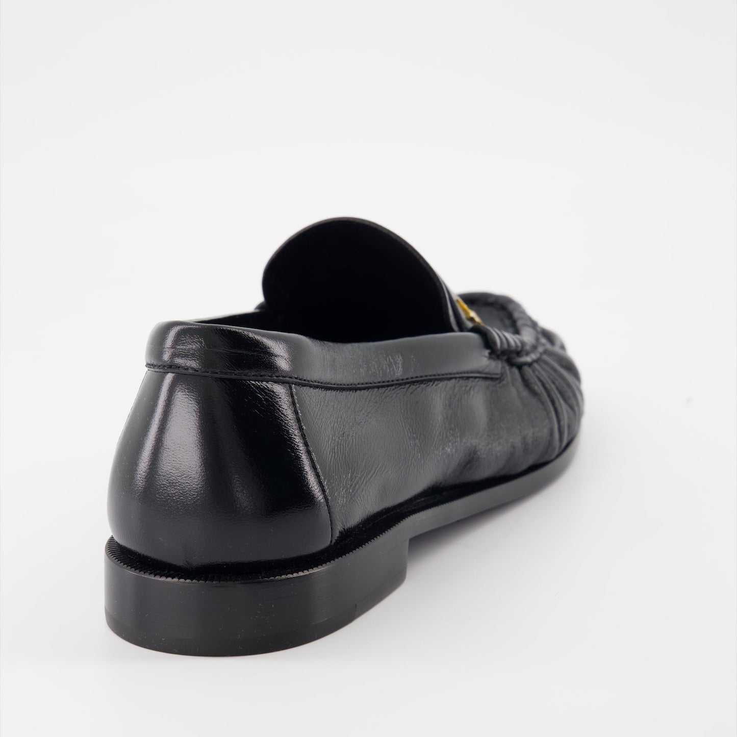 Cassandre leather moccasins, luxury footwear, Saint Laurent shoes, elegant menswear, glossy leather moccasins