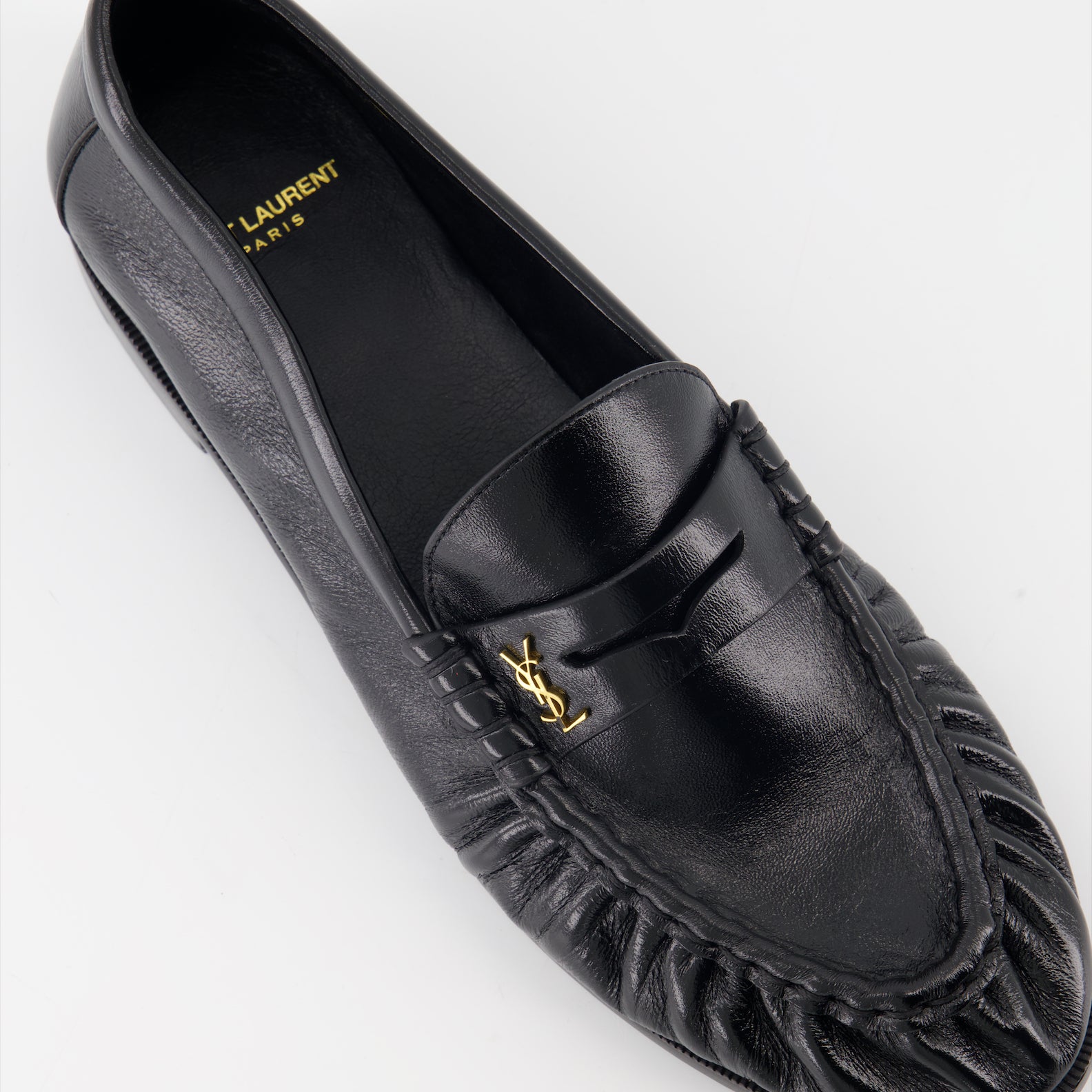 Cassandre leather moccasins, luxury footwear, Saint Laurent shoes, elegant menswear, glossy leather moccasins