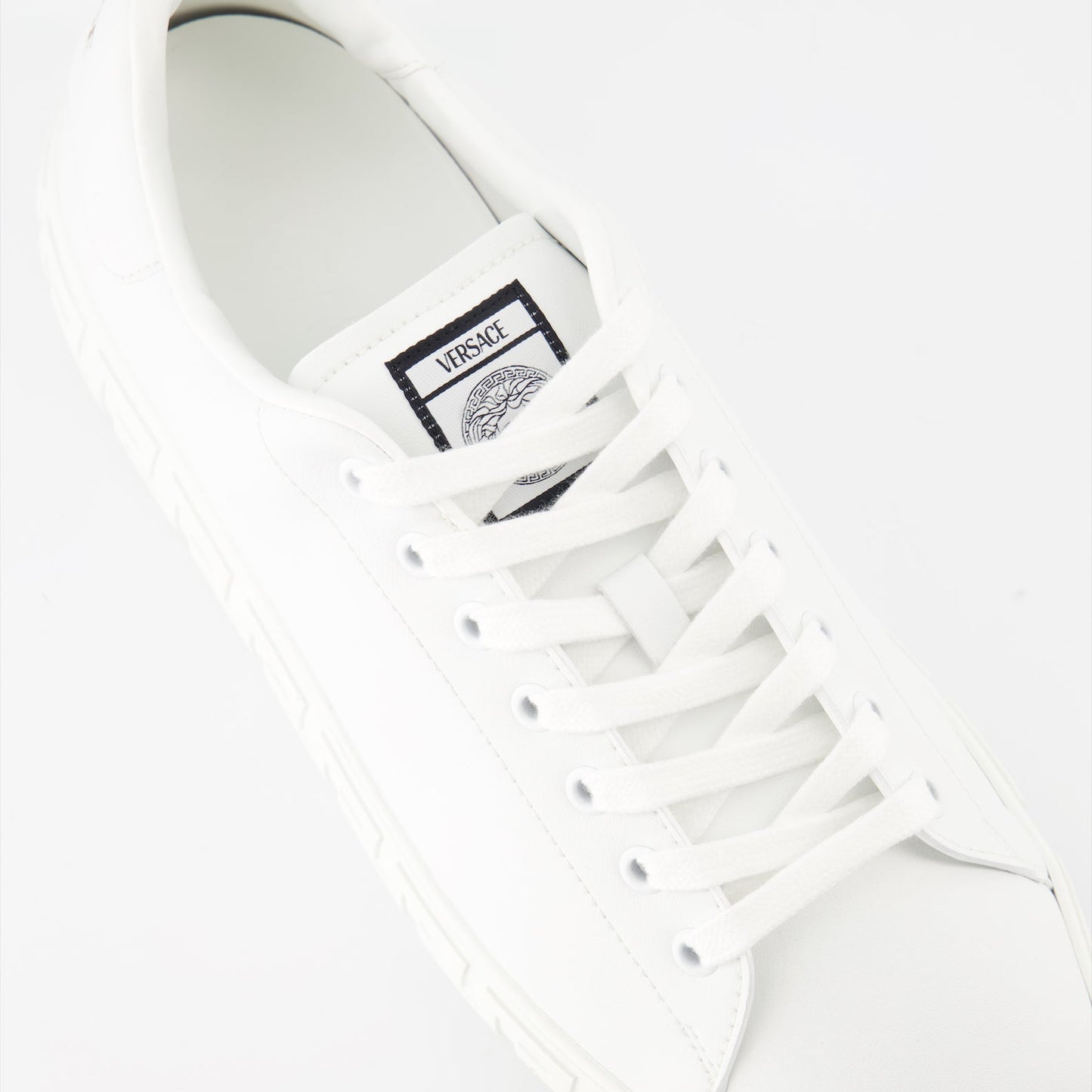 luxury sneakers, Versace footwear, white sneakers, Greca pattern, premium sneakers