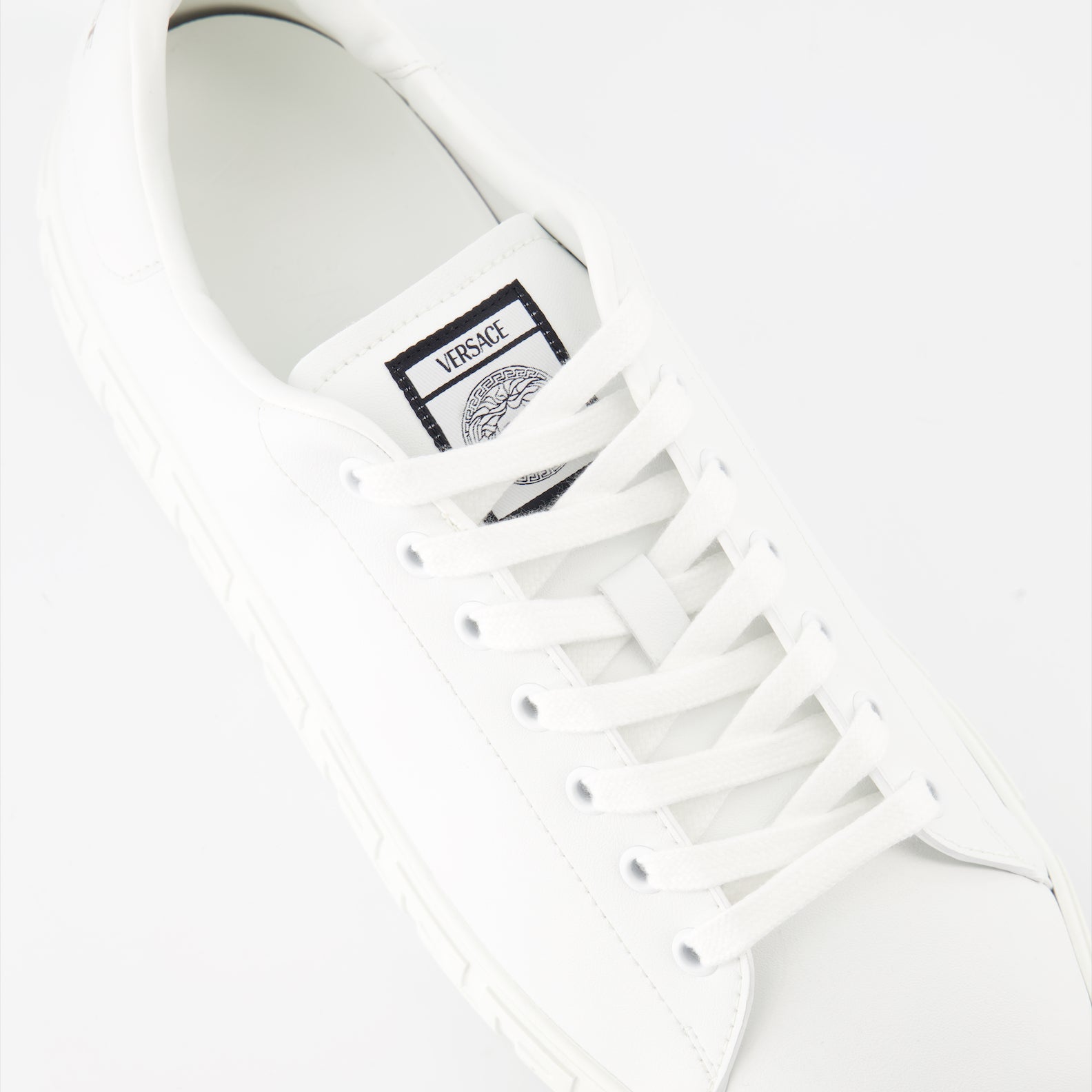 luxury sneakers, Versace footwear, white sneakers, Greca pattern, premium sneakers