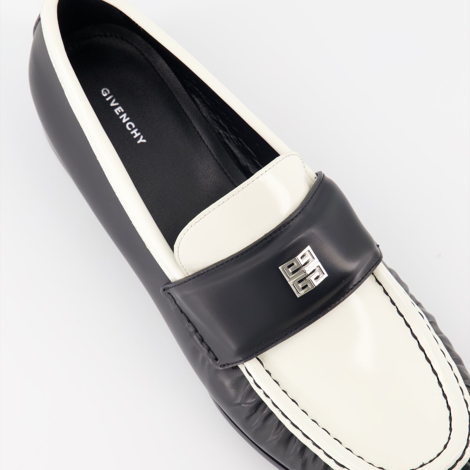 Givenchy leather moccasins, luxury footwear, 4G emblem shoes, elegant moccasins, white and black moccasins