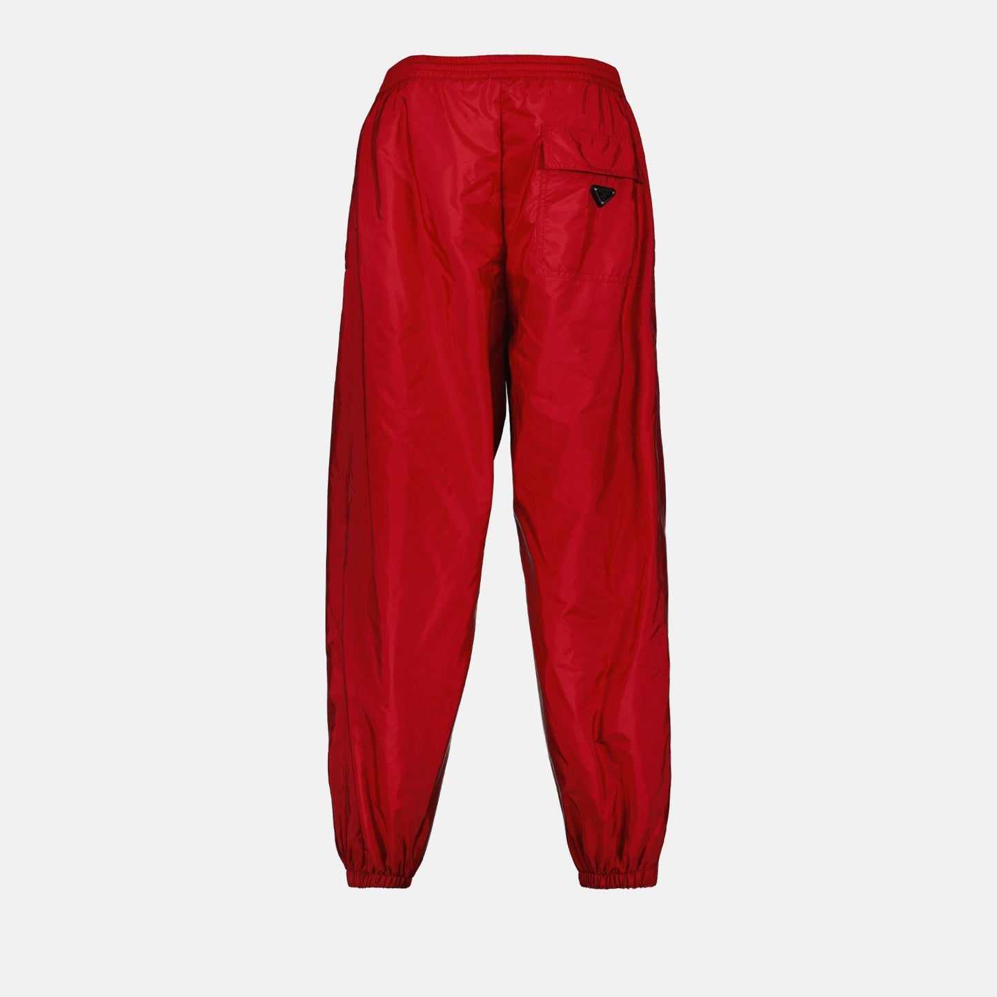 Prada jogging pants, Re-Nylon pants, luxury activewear, eco-friendly fashion, red jogging pants