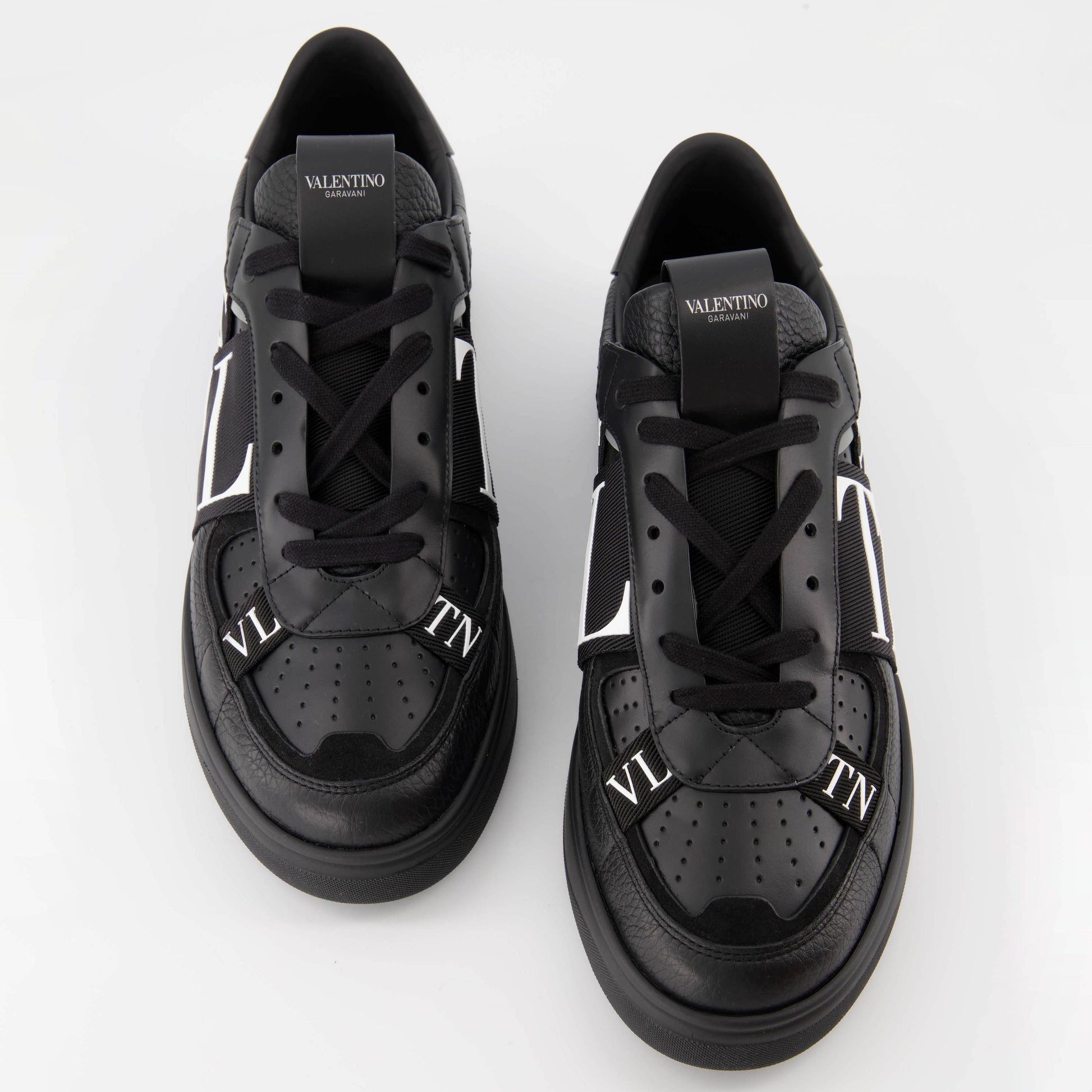 luxury sneakers, Valentino Garavani, black leather sneakers, designer footwear, high-end fashion