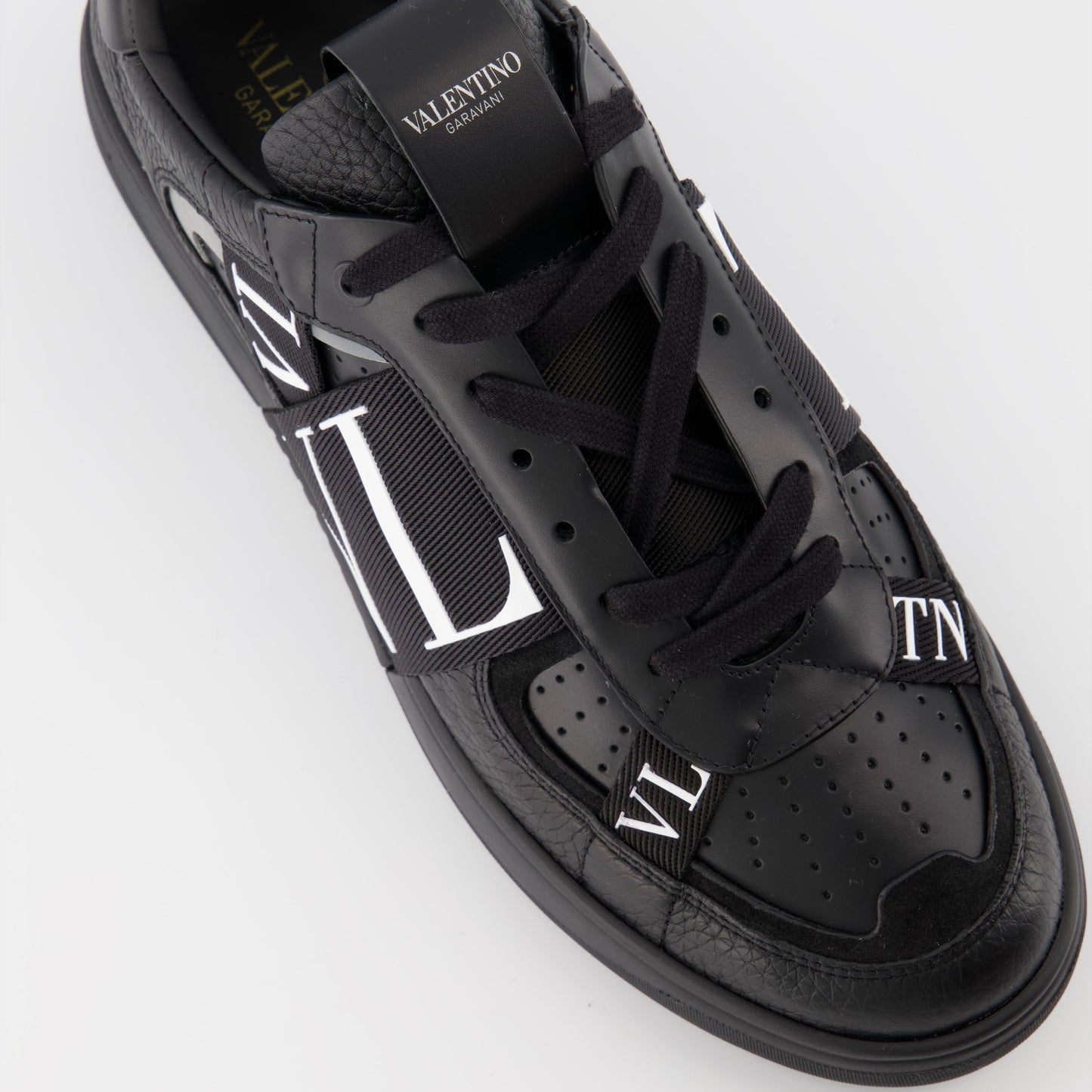 luxury sneakers, Valentino Garavani, black leather sneakers, designer footwear, high-end fashion