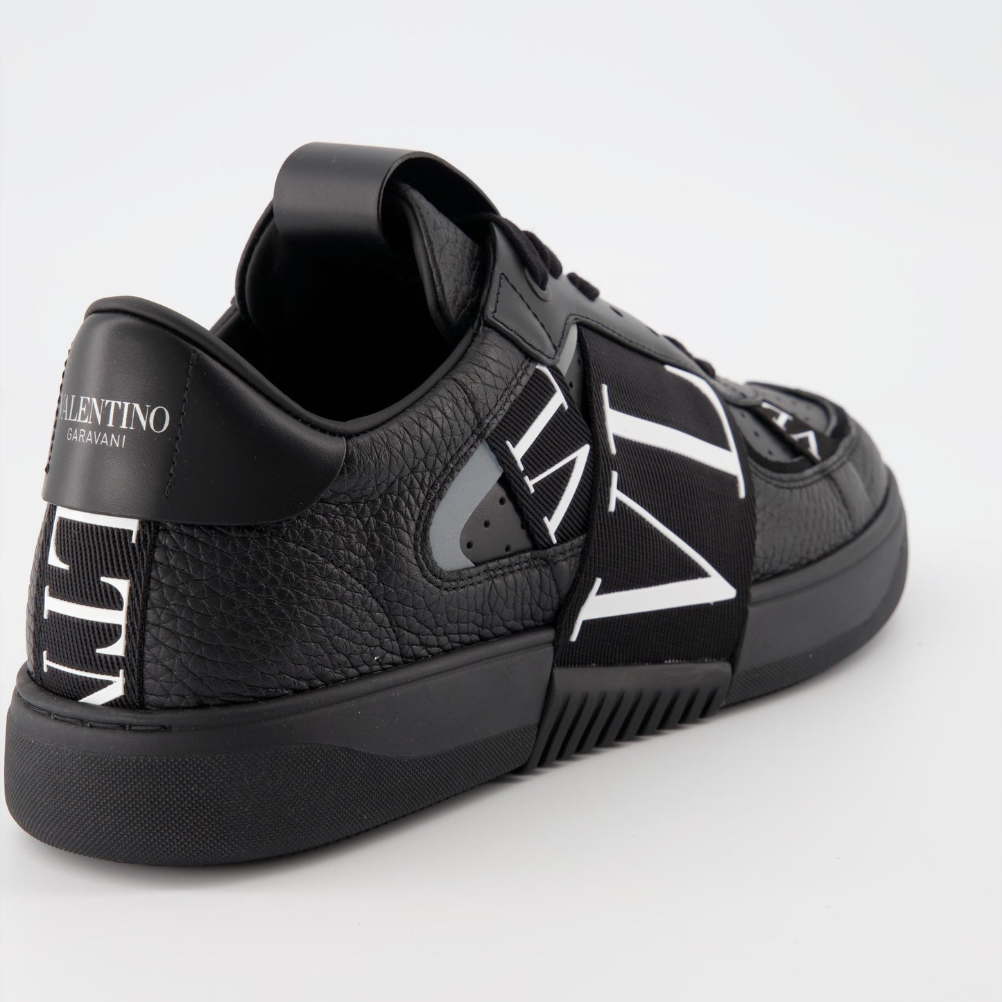 luxury sneakers, Valentino Garavani, black leather sneakers, designer footwear, high-end fashion