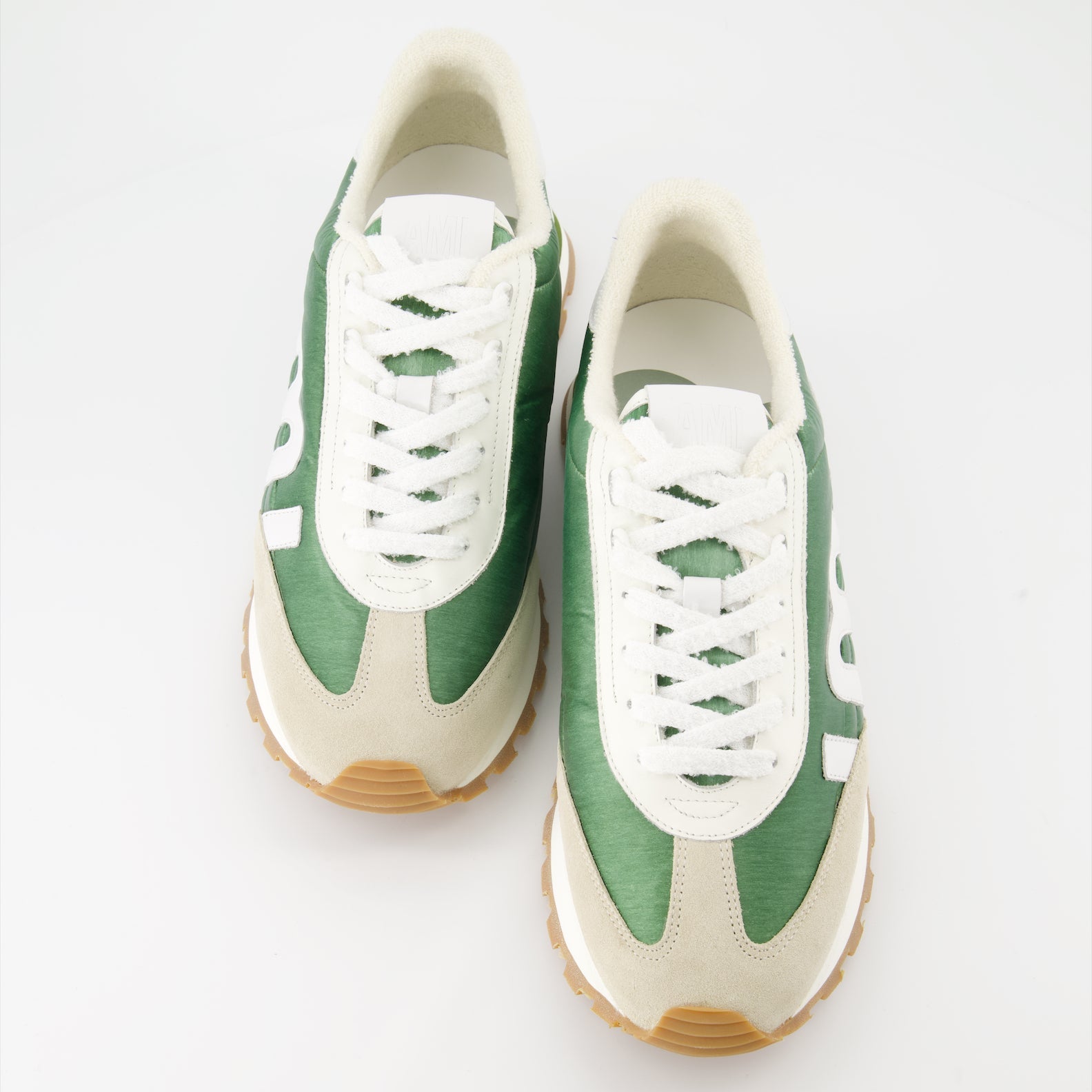 AMI Rush sneakers, green nylon sneakers, beige leather sneakers, luxury men's footwear, designer sneakers